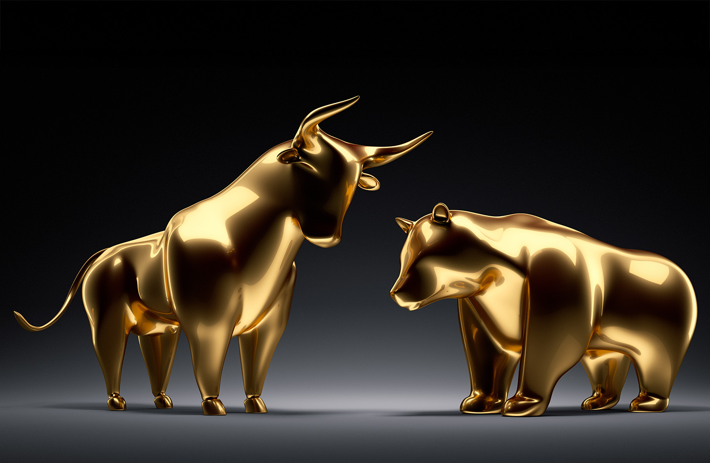 Bulle und Bär in gold vor dunklem Hintergrund